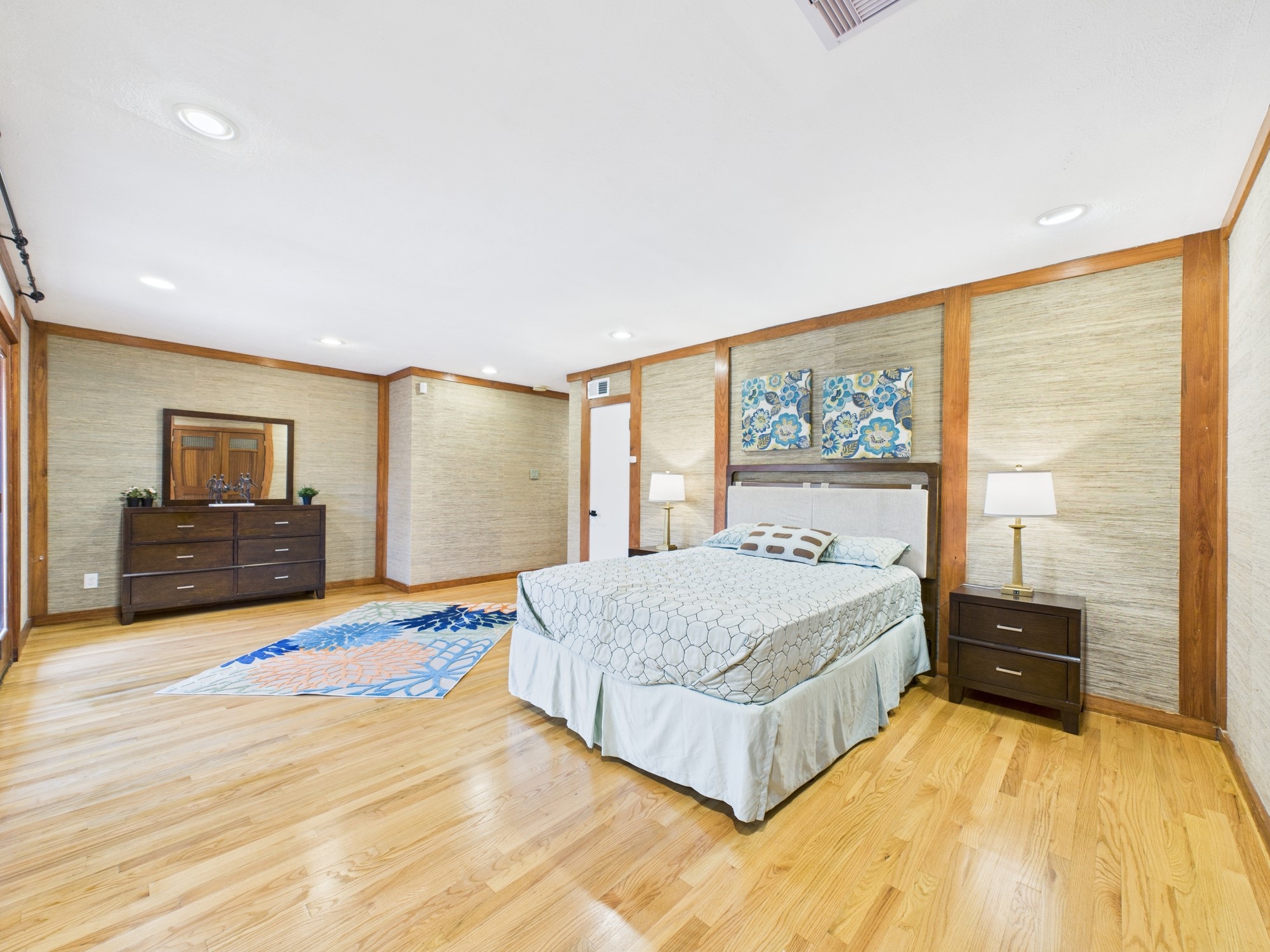 2432 Chimney Rock Road Houston, TX 77057 - Photo 31 of 43 a spacious bedroom with a bed and a large window