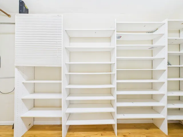 a bedroom with a large bed and a couch