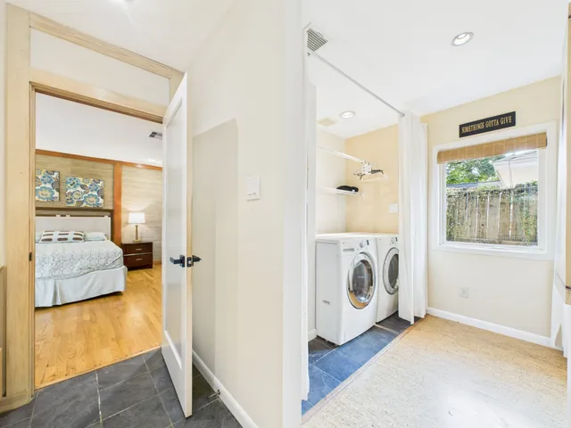 a bathroom with a tub sink and a mirror
