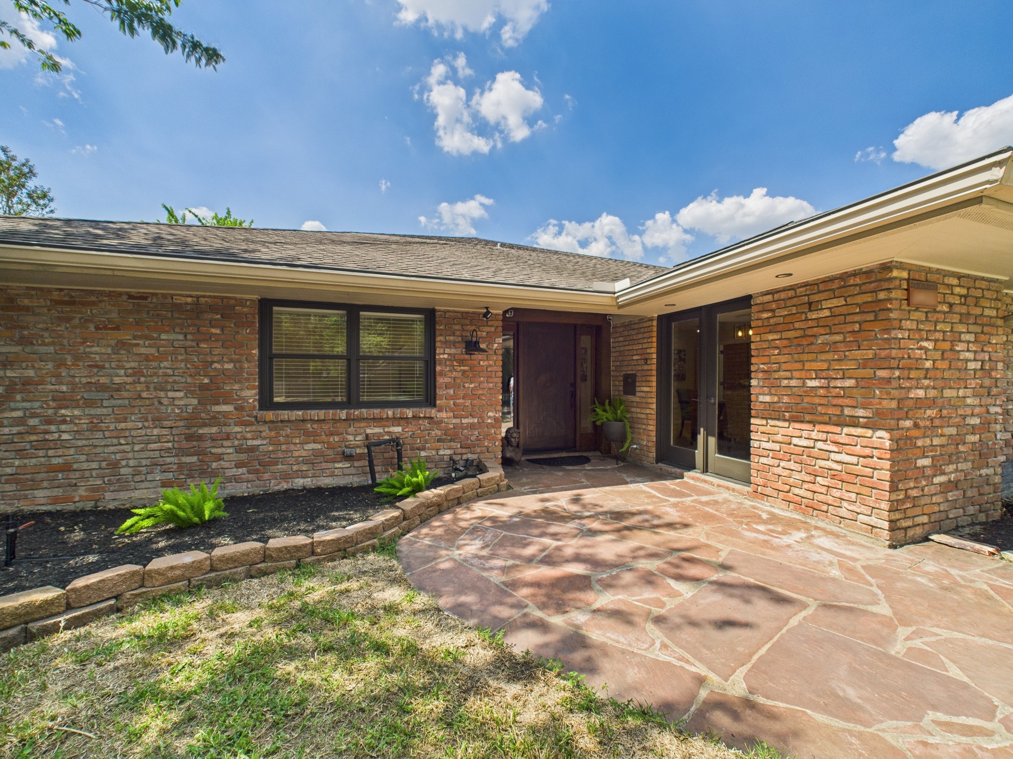 2432 Chimney Rock Road Houston, TX 77057 - Photo 39 of 43 a front view of a house with a yard