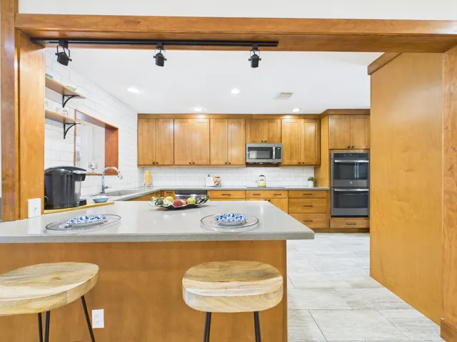 a view of a living room and dining room