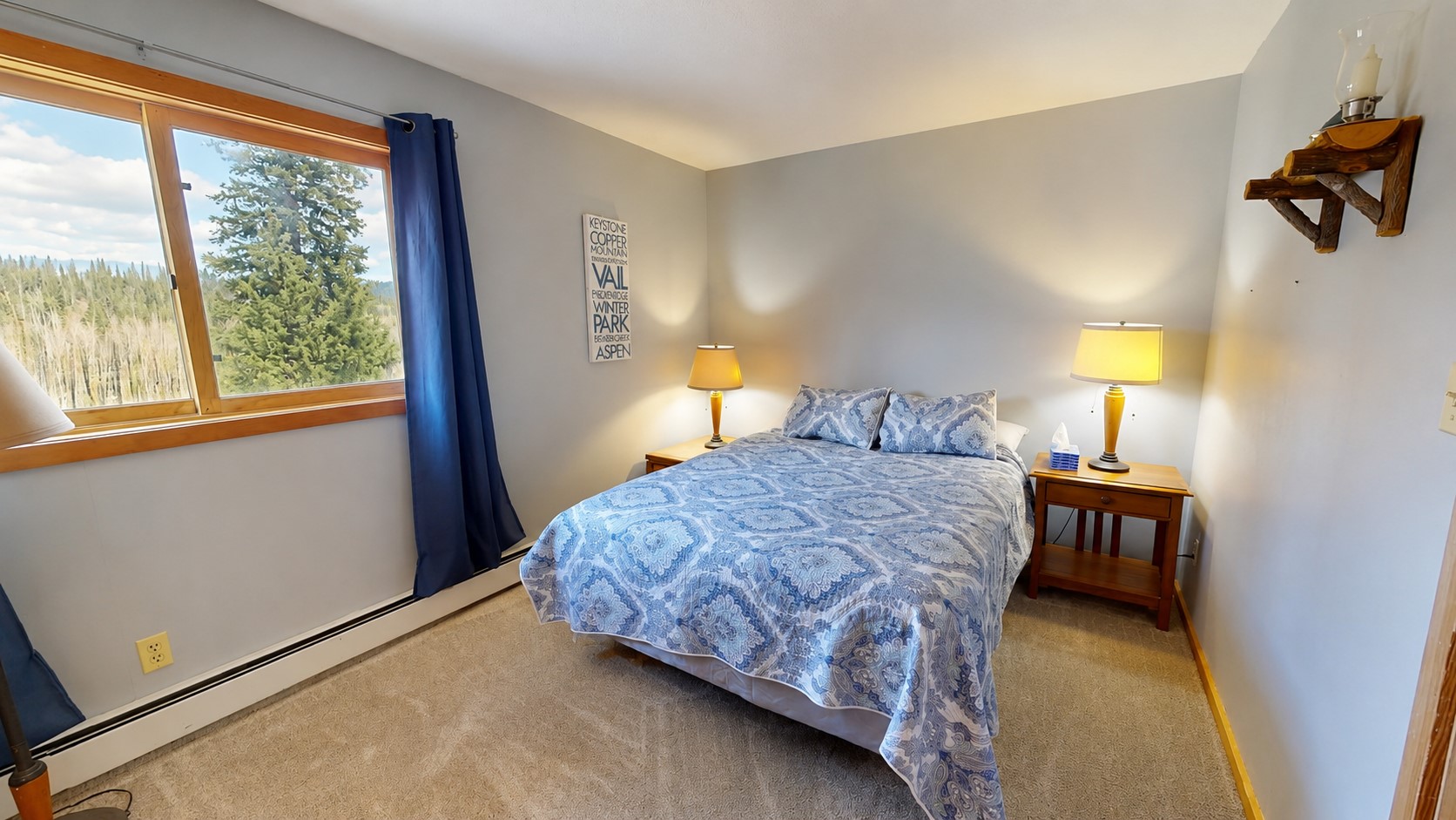 91200 Ryan Gulch Road, Unit 213 Silverthorne, CO 80498 - Photo 13 of 33 a bedroom with a bed and a window