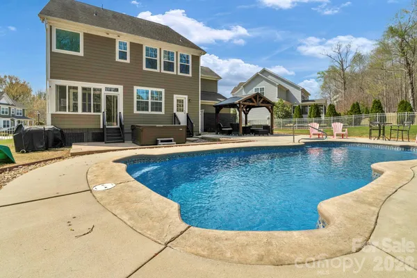 a view of a swimming pool with a lounge chairs