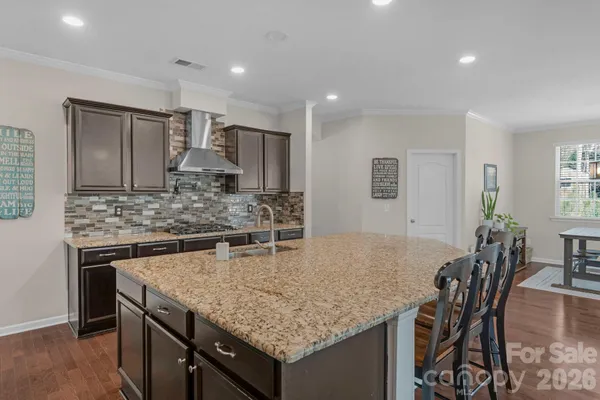 a kitchen with a table and chairs in it