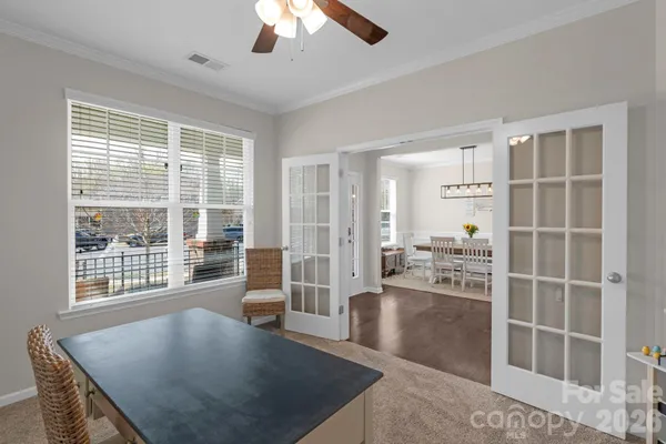 a view of a livingroom with furniture and a window