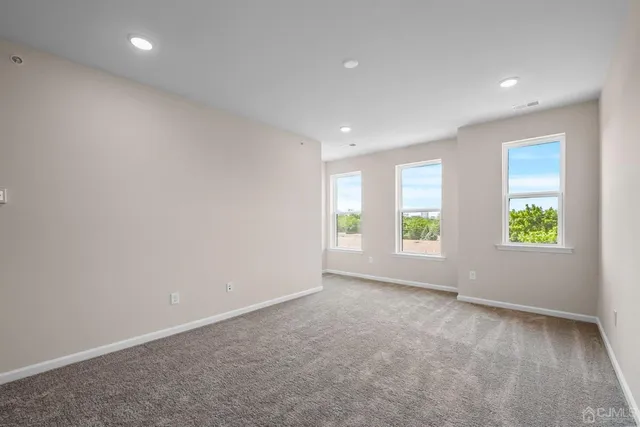 a bathroom with double sink and a mirror