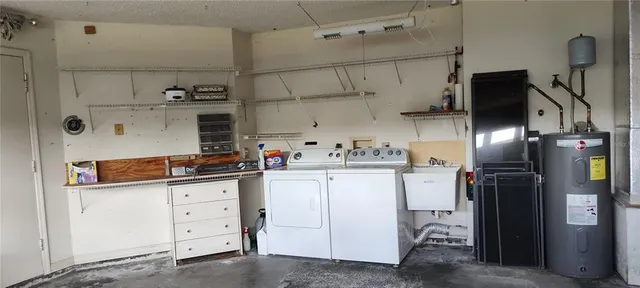 a kitchen with refrigerator and cabinets