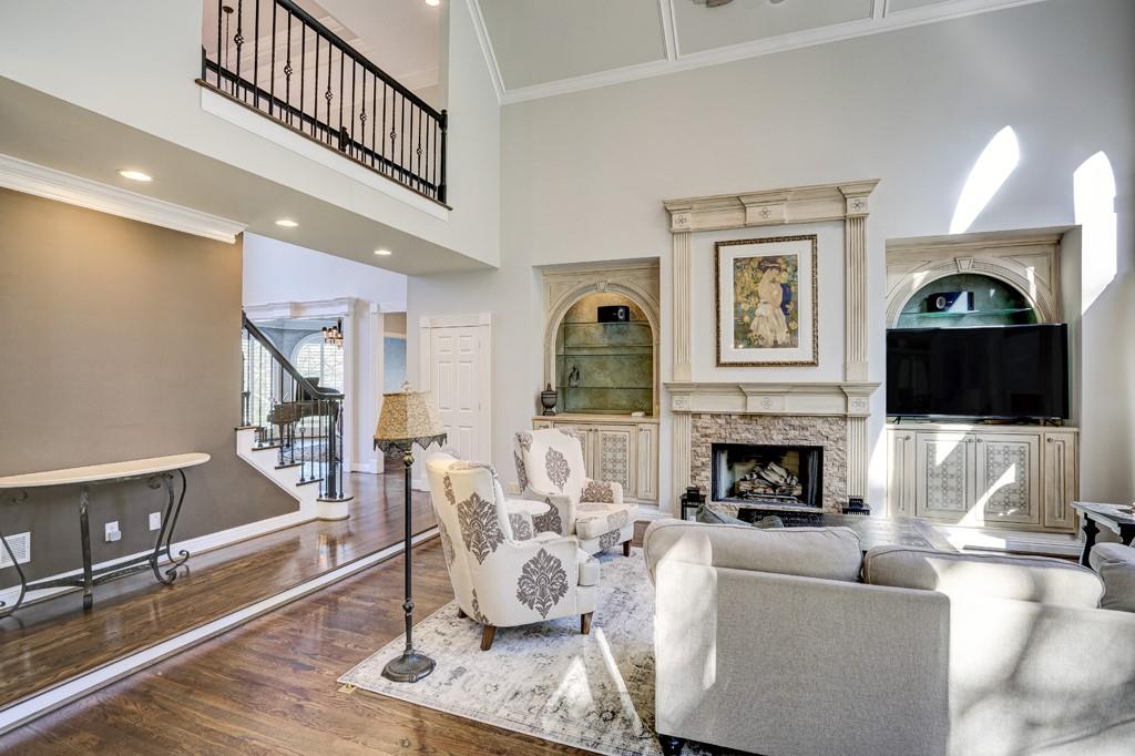 5940 Whitestone Lane Suwanee, GA 30024 - Photo 11 of 63 a living room with furniture fireplace and flat screen tv