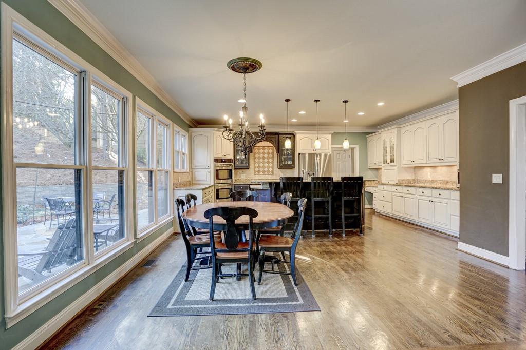 5940 Whitestone Lane Suwanee, GA 30024 - Photo 18 of 63 a view of a dining room with furniture window and wooden floor