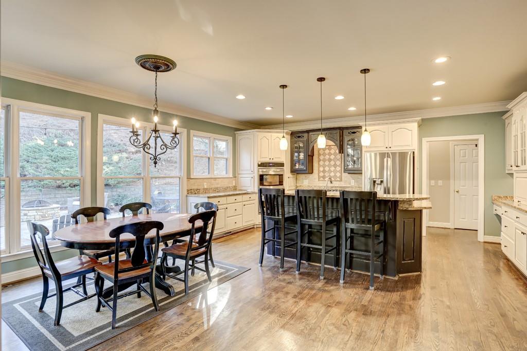 5940 Whitestone Lane Suwanee, GA 30024 - Photo 19 of 63 a view of a dining room with furniture window and outside view