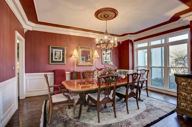 a view of a patio with table and chairs and potted plants
