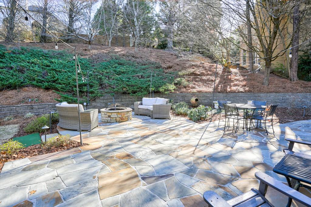 5940 Whitestone Lane Suwanee, GA 30024 - Photo 3 of 63 a view of a backyard with sitting area