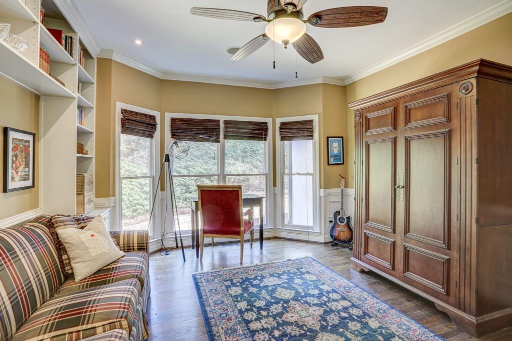5940 Whitestone Lane Suwanee, GA 30024 - Photo 31 of 63 a living room with furniture fireplace and a window