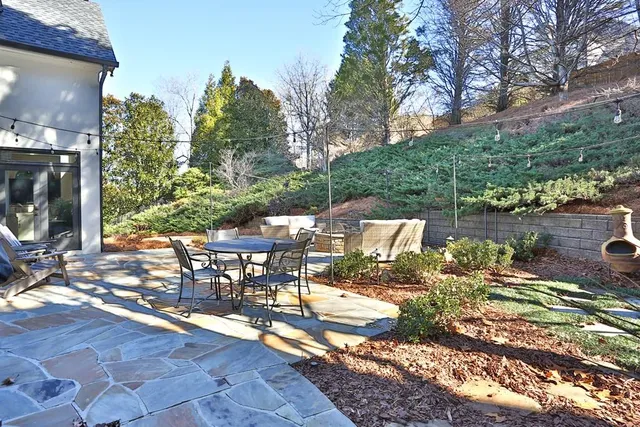 a bed room with a bed and a chandelier