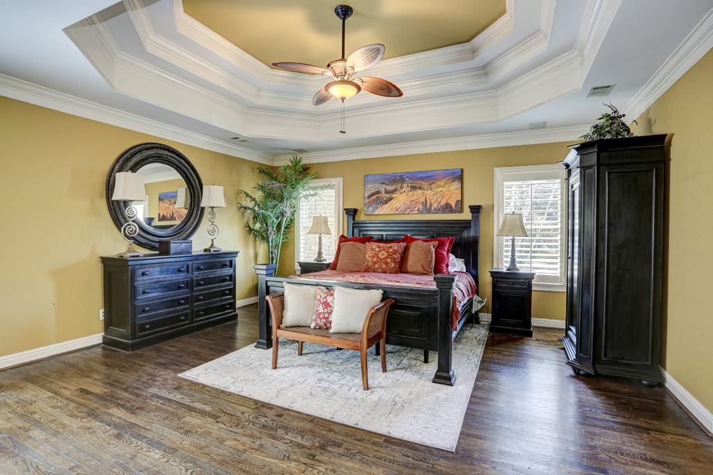 5940 Whitestone Lane Suwanee, GA 30024 - Photo 40 of 63 a bed room with a bed and a chandelier