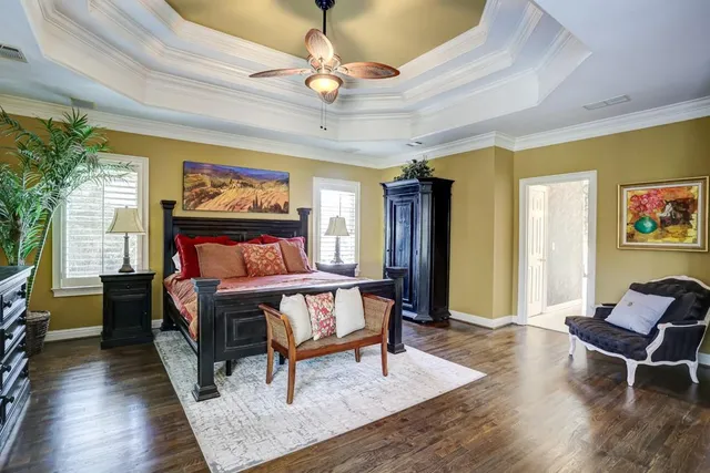 a bedroom with a bed and a table in it