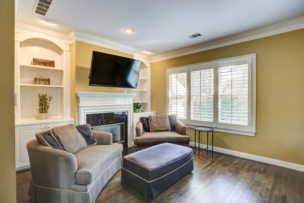 5940 Whitestone Lane Suwanee, GA 30024 - Photo 44 of 63 a living room with furniture fireplace and flat screen tv
