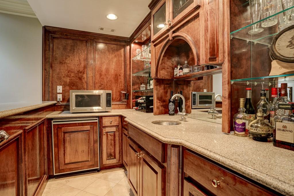 5940 Whitestone Lane Suwanee, GA 30024 - Photo 55 of 63 a kitchen with stainless steel appliances granite countertop a sink and cabinets