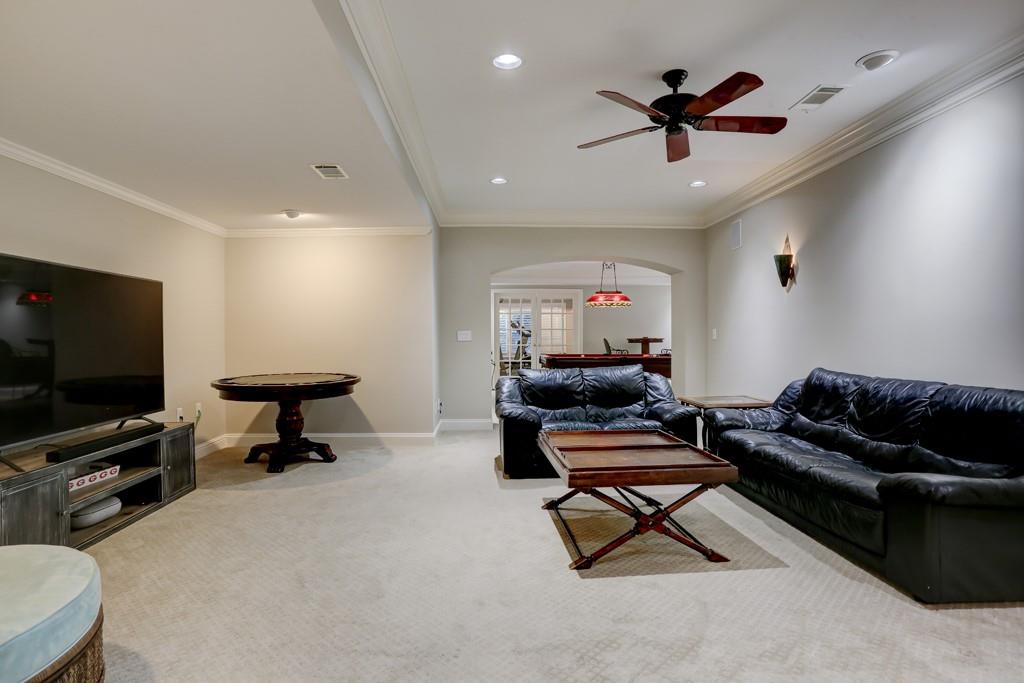 5940 Whitestone Lane Suwanee, GA 30024 - Photo 56 of 63 a living room with furniture and a flat screen tv