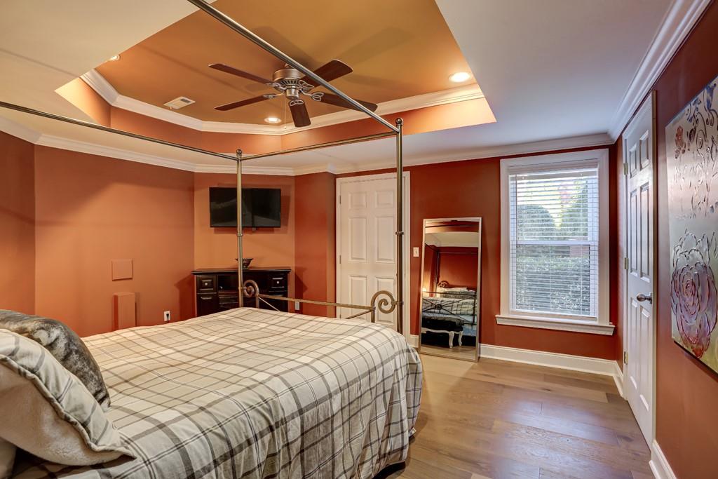 5940 Whitestone Lane Suwanee, GA 30024 - Photo 61 of 63 a bedroom with a large bed and a large window