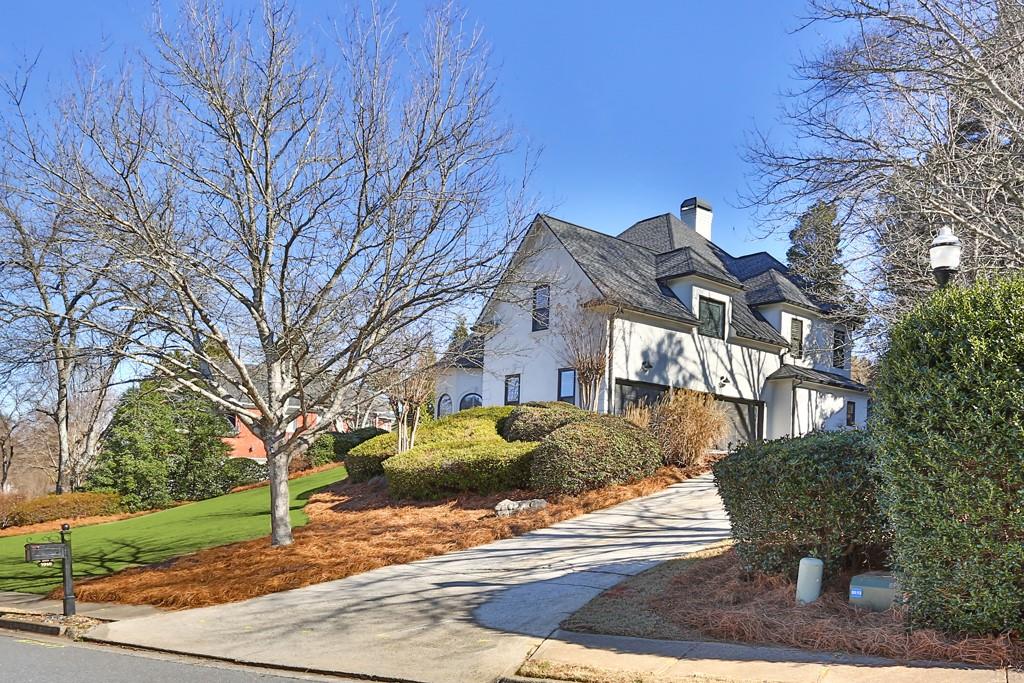 5940 Whitestone Lane Suwanee, GA 30024 - Photo 7 of 63 a front view of a house with a yard