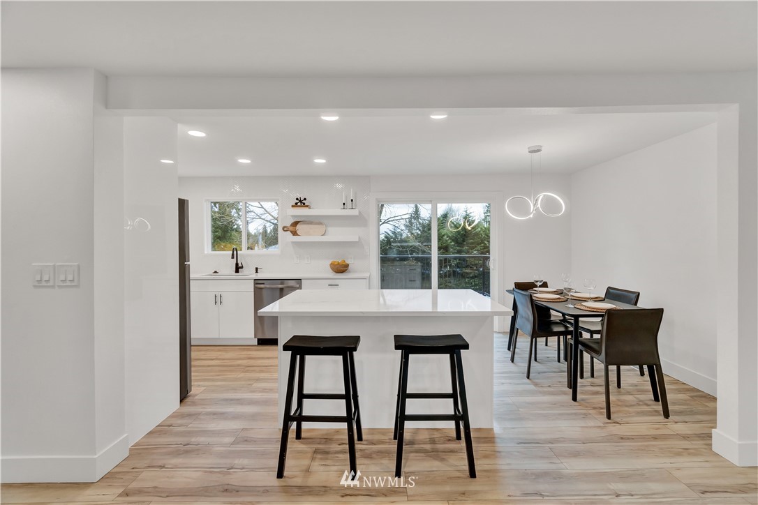 4606 237th Place Southwest Mountlake Terrace, WA 98043 - Photo 12 of 40 a dining room with furniture and wooden floor