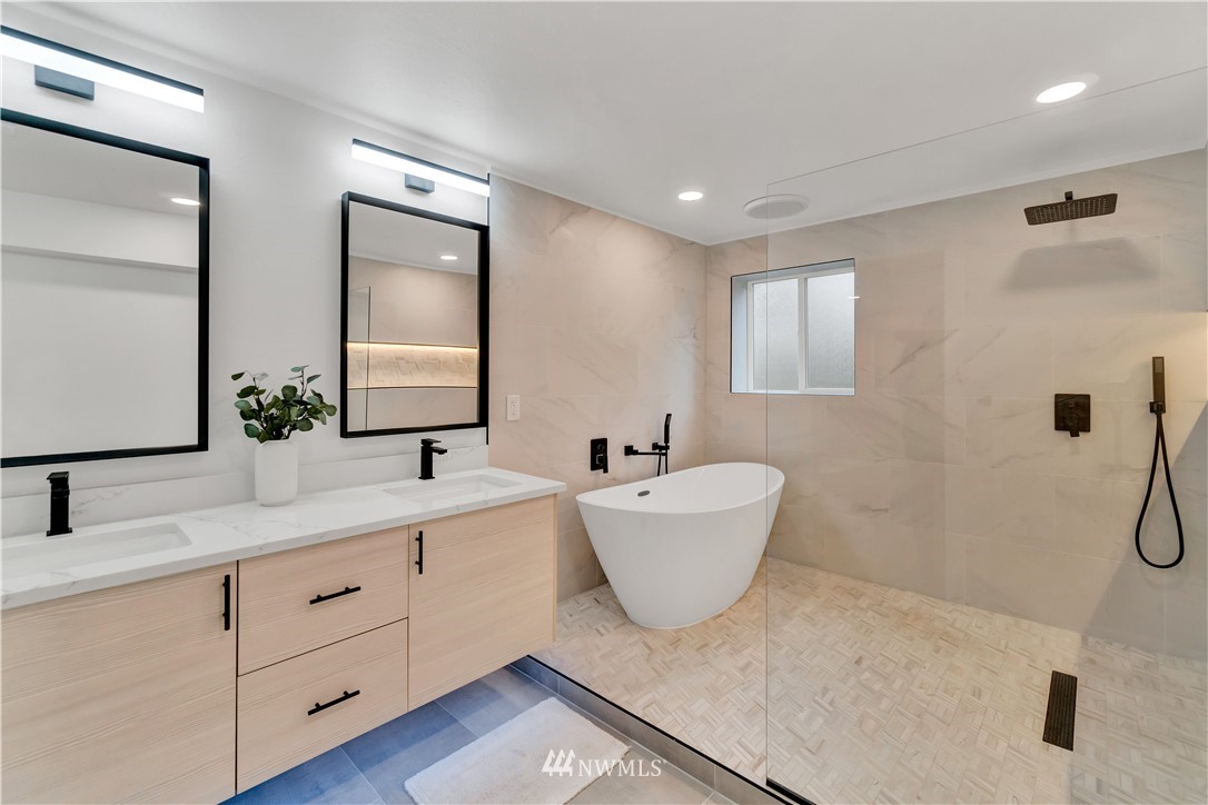 4606 237th Place Southwest Mountlake Terrace, WA 98043 - Photo 28 of 40 a bathroom with a bathtub a sink and a window