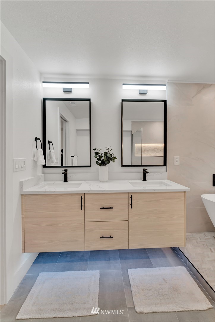 4606 237th Place Southwest Mountlake Terrace, WA 98043 - Photo 29 of 40 a bathroom with double vanity and a mirror