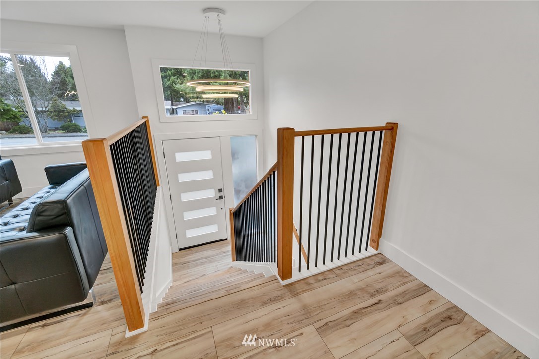 4606 237th Place Southwest Mountlake Terrace, WA 98043 - Photo 6 of 40 an entryway with wooden floor and windows