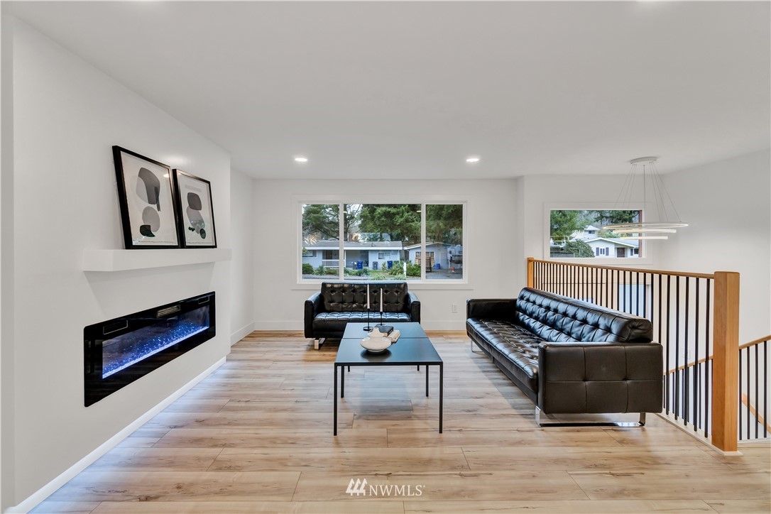 4606 237th Place Southwest Mountlake Terrace, WA 98043 - Photo 9 of 40 a living room with furniture a rug and a window