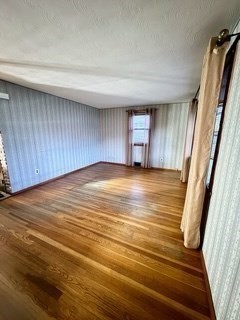 16 Gary Road Springfield, MA 01119 - Photo 11 of 22 a view of an empty room with wooden floor and a window