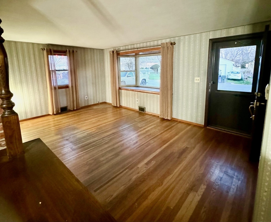16 Gary Road Springfield, MA 01119 - Photo 12 of 22 wooden floor in an empty room with a window