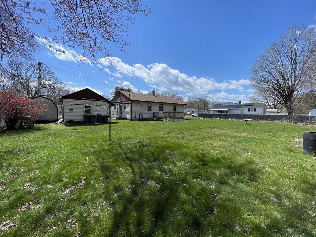 16 Gary Road Springfield, MA 01119 - Photo 6 of 22 a view of a house with a big yard and large trees