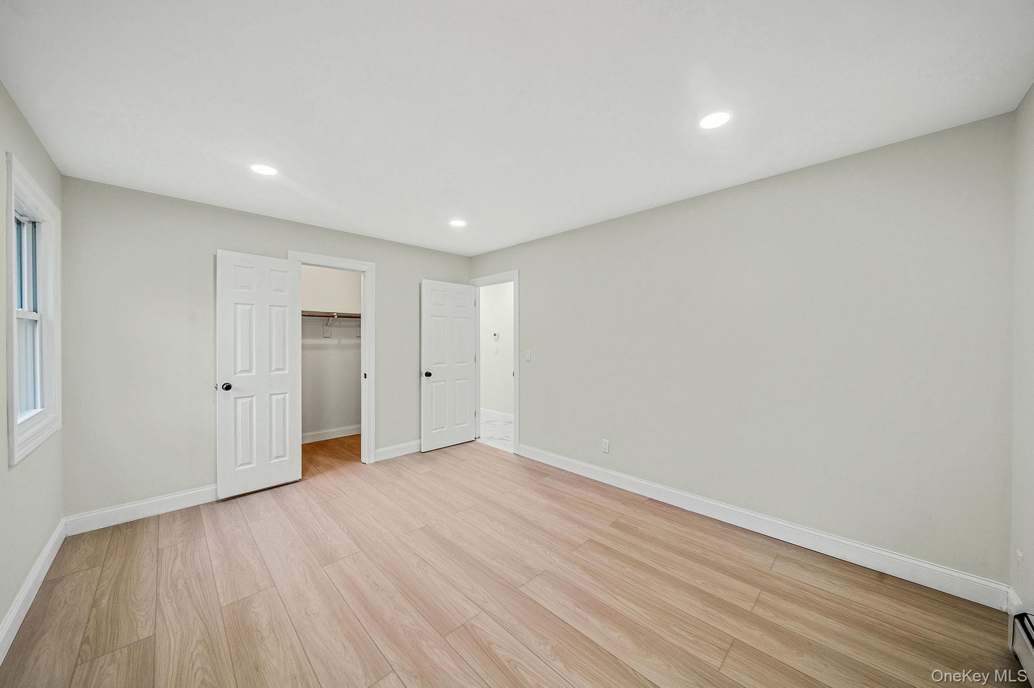 50 7th Street St. James, NY 11780 - Photo 16 of 25 a view of an empty room with wooden floor