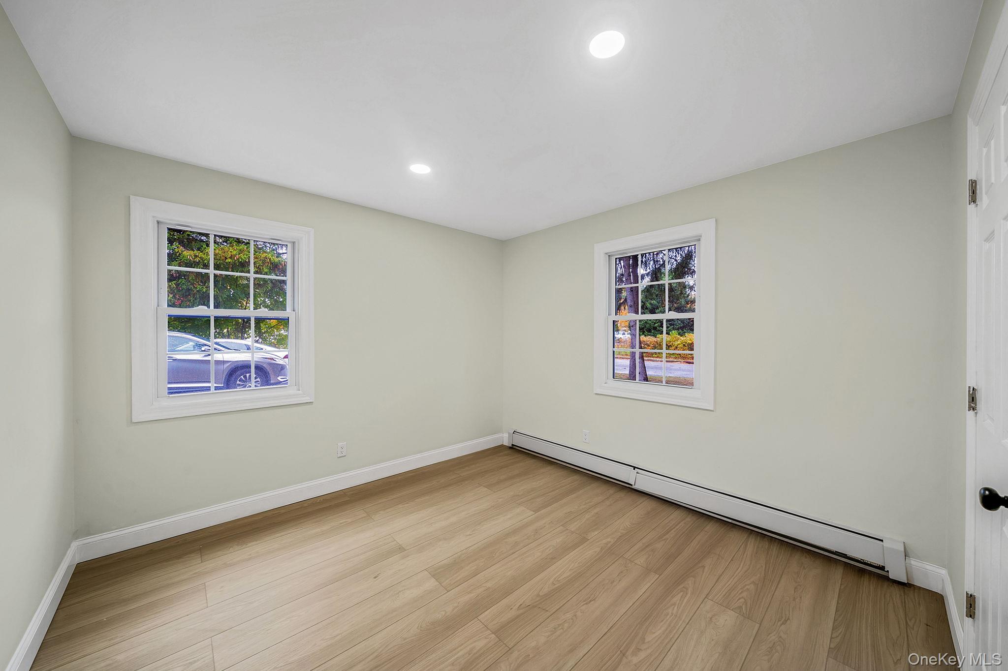 50 7th Street St. James, NY 11780 - Photo 17 of 25 an empty room with windows