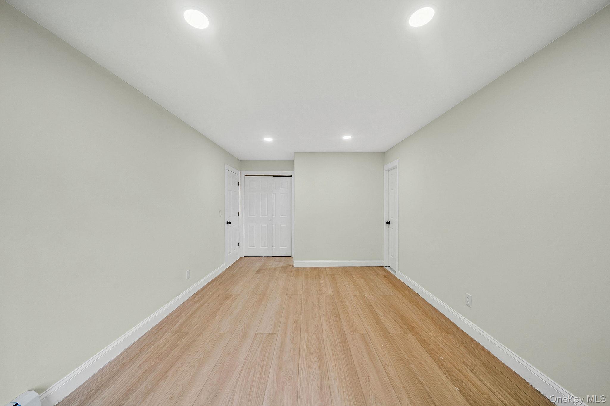 50 7th Street St. James, NY 11780 - Photo 20 of 25 a view of room with wooden floor