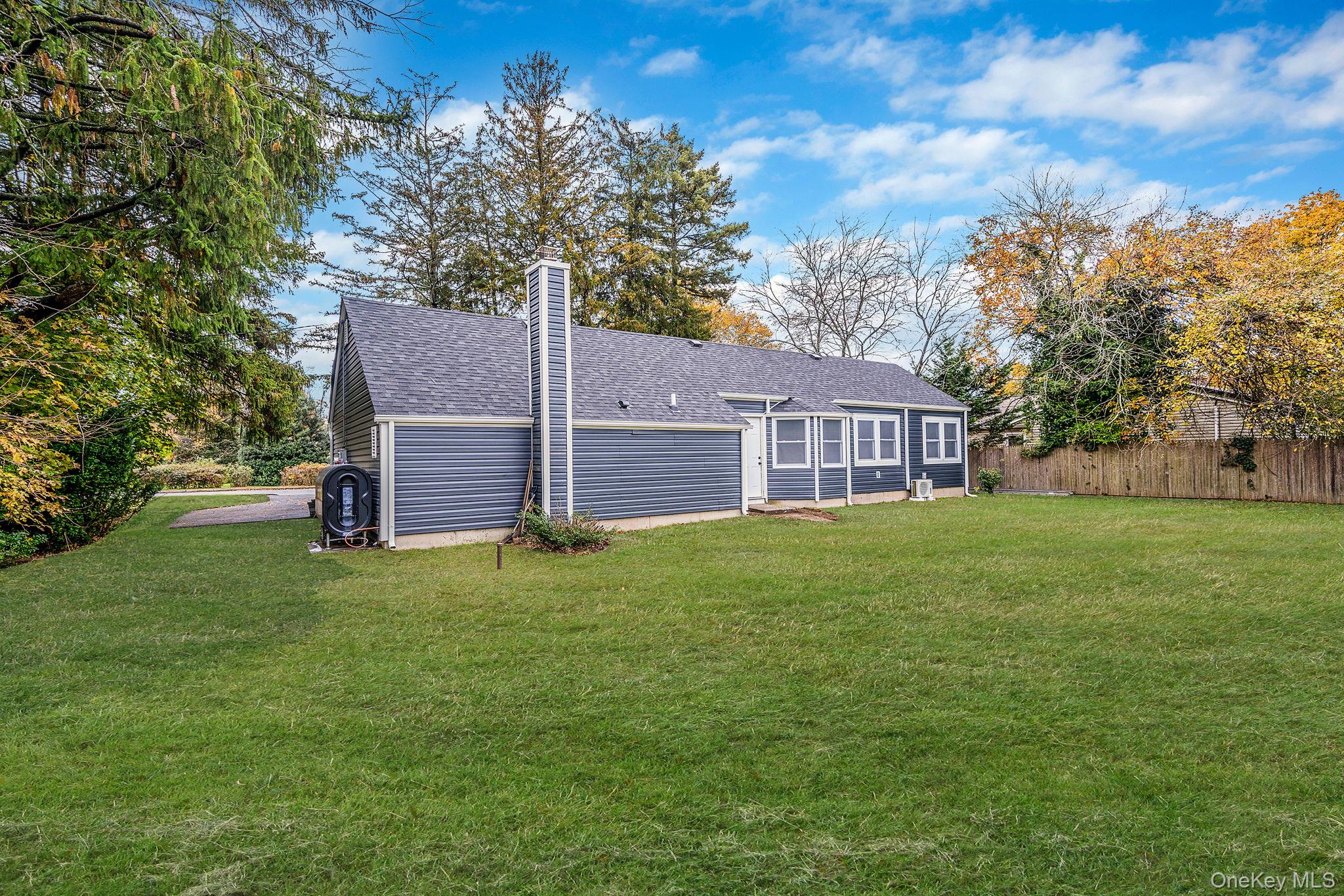 50 7th Street St. James, NY 11780 - Photo 25 of 25 a view of a house with a backyard