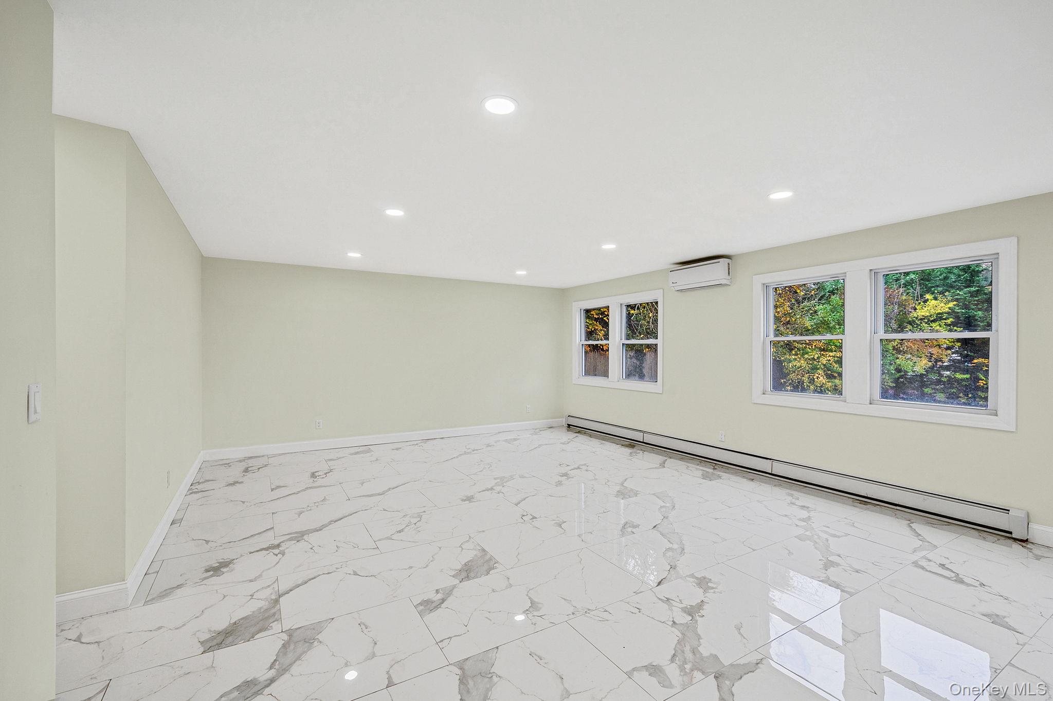 50 7th Street St. James, NY 11780 - Photo 8 of 25 a view of an empty room with a window