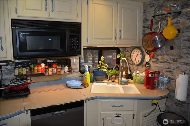 a kitchen with a sink and cabinets