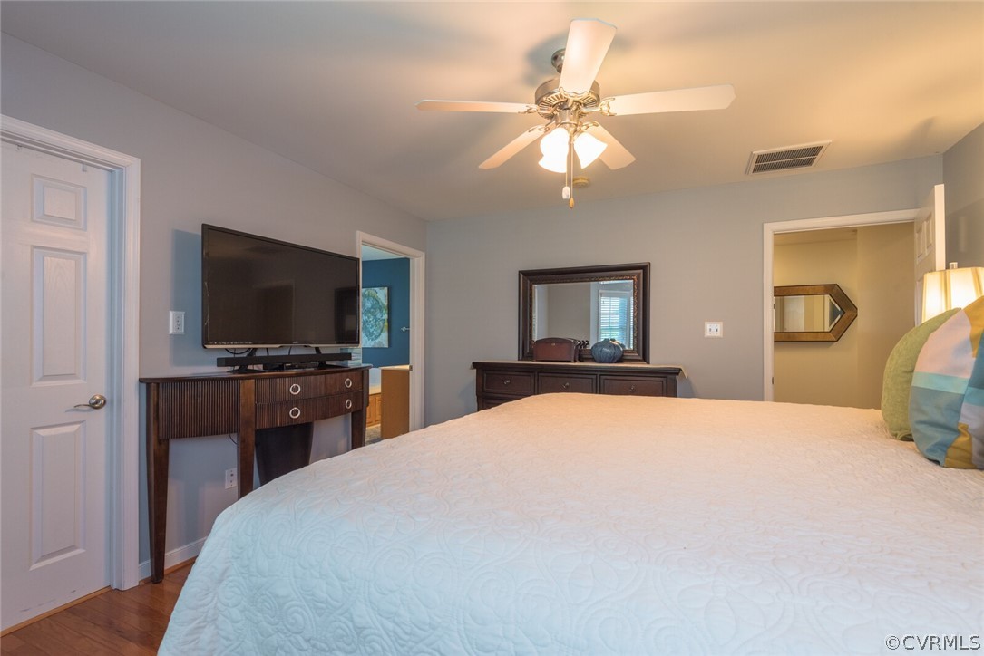 11616 Hillside Road Chester, VA 23831 - Photo 20 of 42 a bedroom with a bed and a flat screen tv
