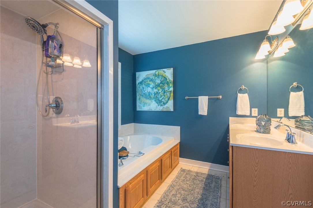 11616 Hillside Road Chester, VA 23831 - Photo 21 of 42 a bathroom with a tub sink and mirror