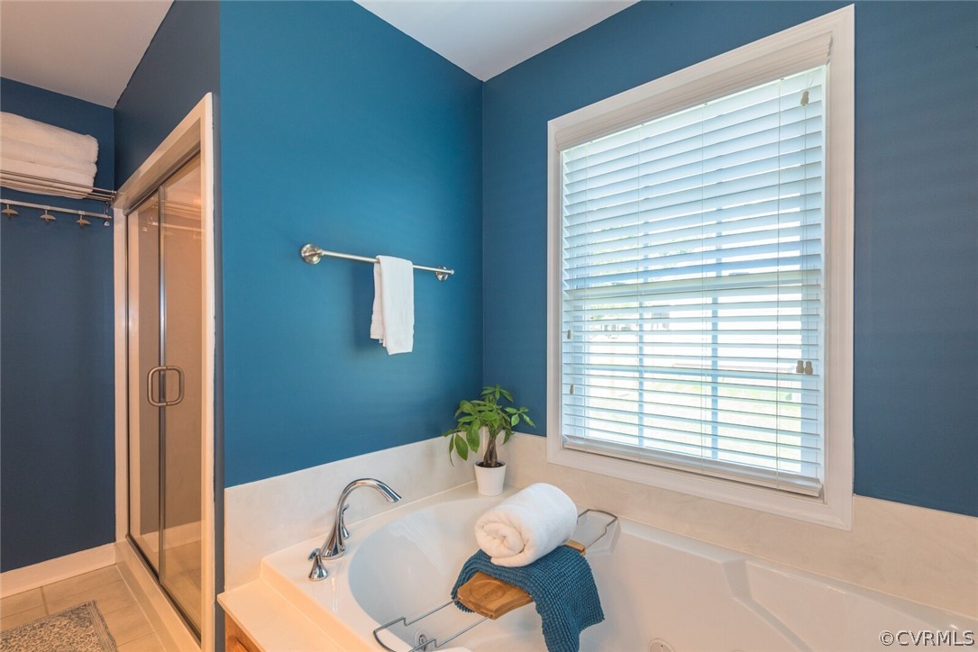 11616 Hillside Road Chester, VA 23831 - Photo 23 of 42 a bath room with a bathtub and a window