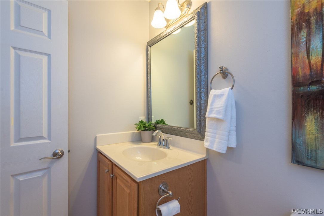 11616 Hillside Road Chester, VA 23831 - Photo 27 of 42 a bathroom with a sink and a mirror