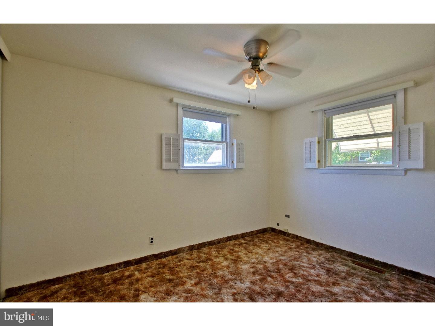 908 Scotia Road Philadelphia, PA 19128 - Photo 14 of 18 wooden floor in an empty room with a window