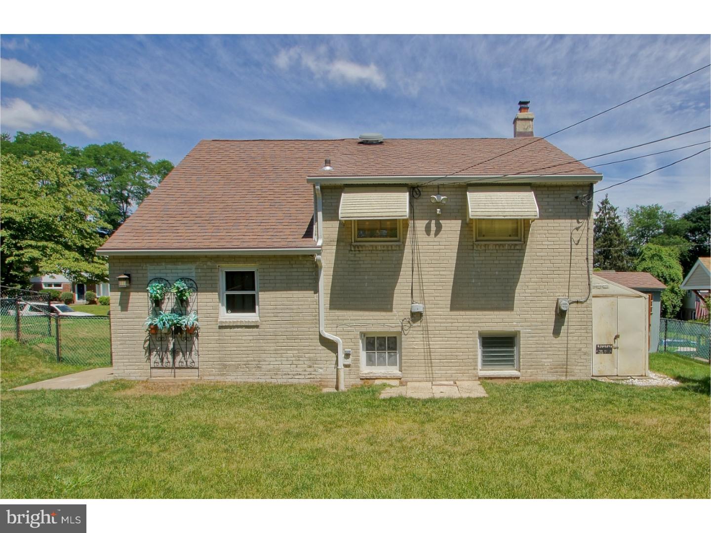 908 Scotia Road Philadelphia, PA 19128 - Photo 4 of 18 a front view of house with a garden