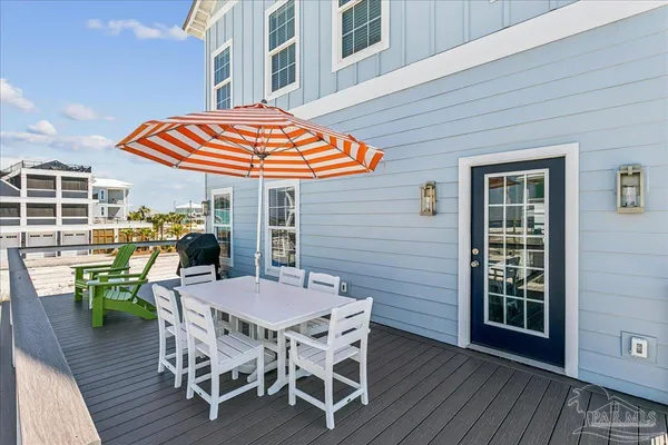 a view of a chairs with a table in the patio