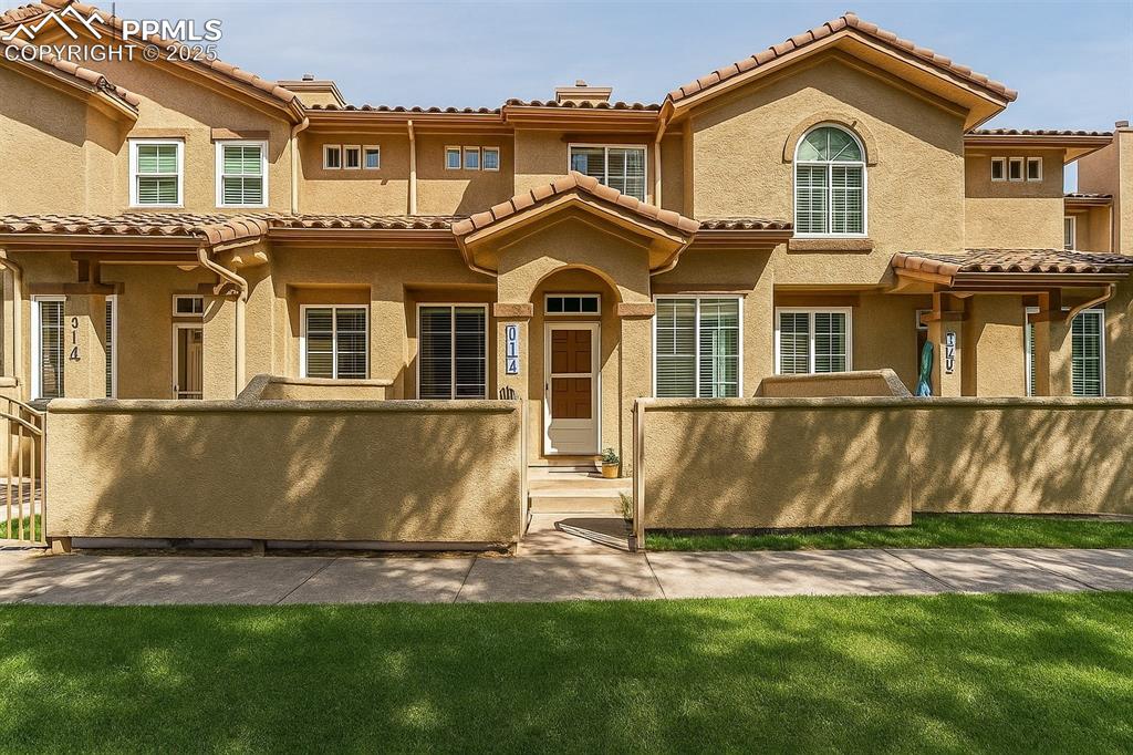 a front view of a house with a yard