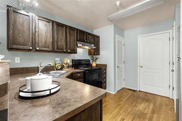 a kitchen with a stove and a sink