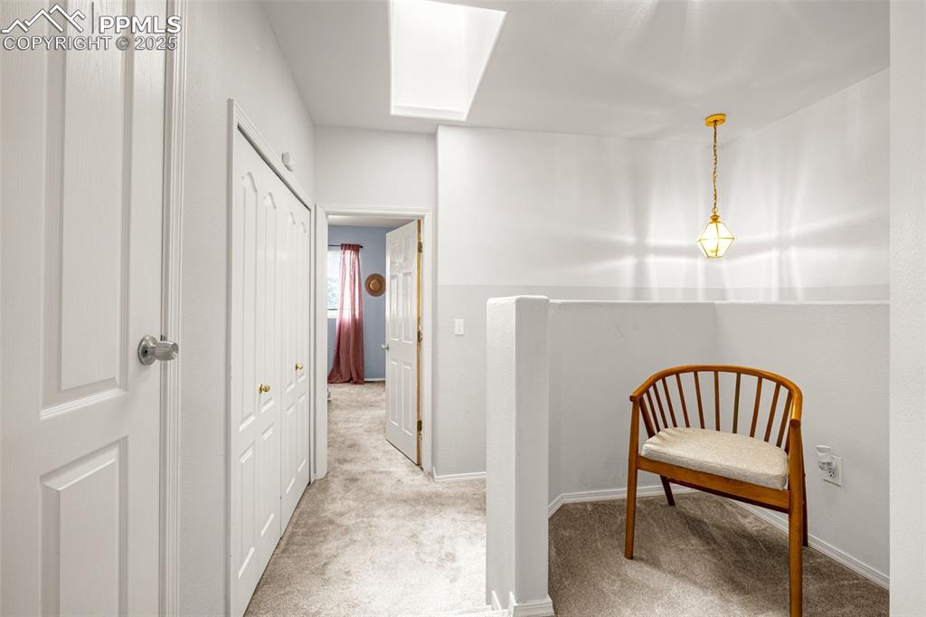 3254 Apogee View Colorado Springs, CO 80906 - Photo 20 of 28 a view of a hallway with seating area