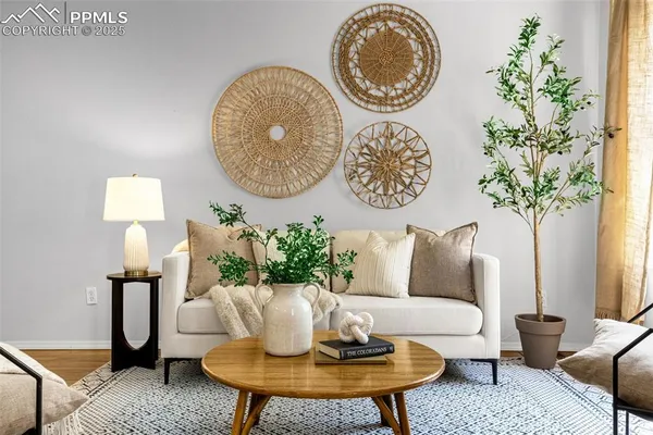 a living room with furniture and a table